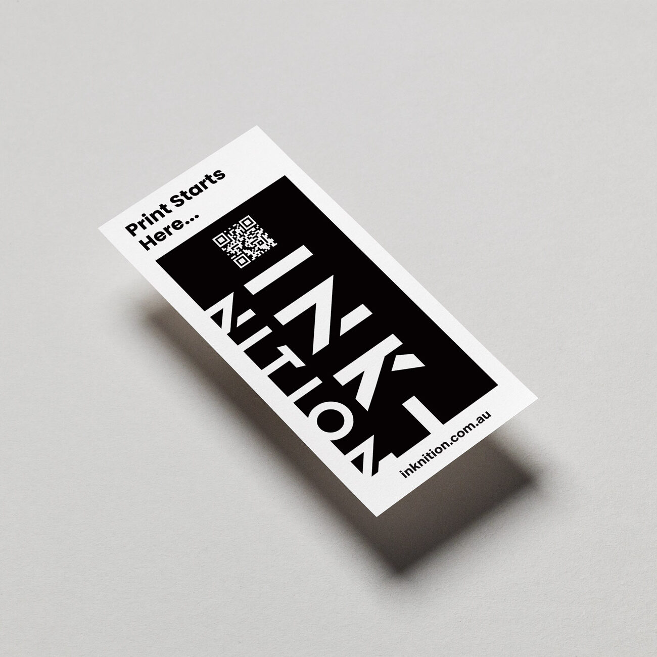 DL Flyers white card stock floating on light grey background